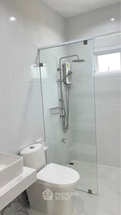 Modern bathroom with glass shower and sleek fixtures