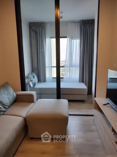 Modern living room with cozy sofa and large window view
