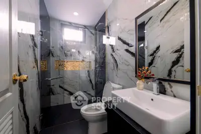 Luxurious modern bathroom with elegant marble tiles and stylish fixtures
