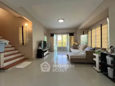 Spacious living room with modern decor and natural light