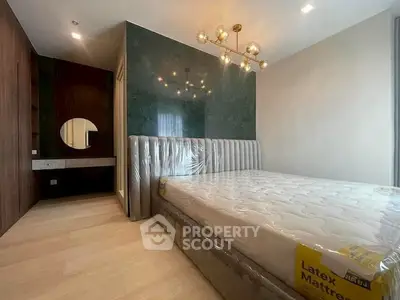 Luxurious bedroom with modern lighting and latex mattress in stylish apartment.