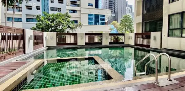 Luxurious urban pool area with modern design and cityscape views, perfect for relaxation and leisure.