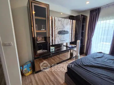 Luxurious bedroom with elegant built-in TV cabinet and floor-to-ceiling curtains