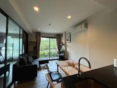 Modern living room with balcony view and sleek interior design
