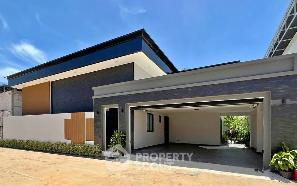 Modern luxury home exterior with spacious garage and sleek architectural design