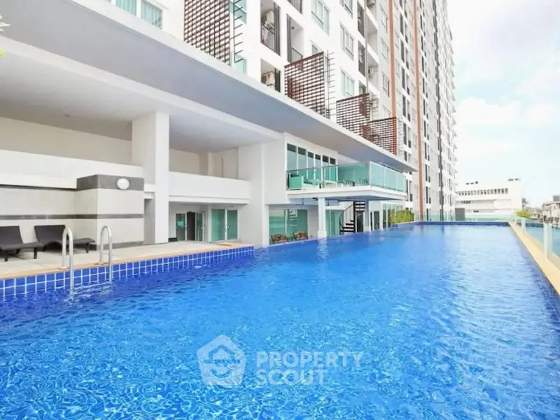 Luxurious high-rise apartment with stunning rooftop pool and modern amenities.