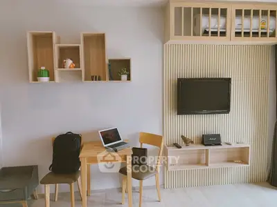 Modern living room with stylish wooden furniture and wall-mounted TV, perfect for cozy urban living.