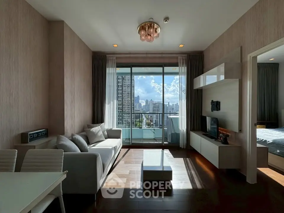 Modern living room with city view, elegant decor, and natural light