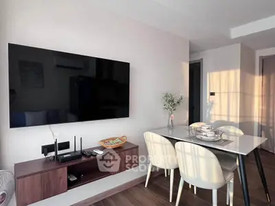 Modern living room with wall-mounted TV and elegant dining area