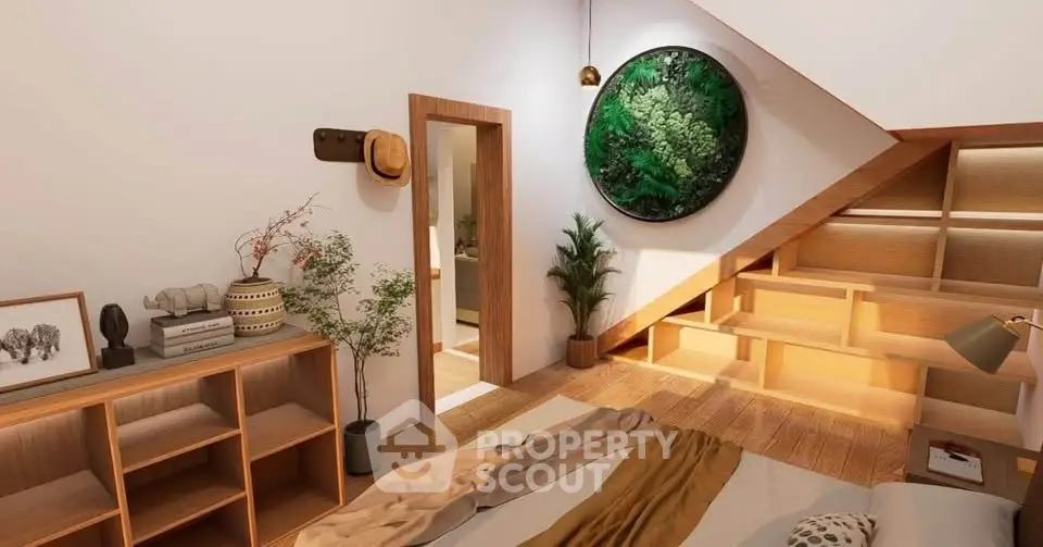 Stylish bedroom with modern decor and unique wall art in cozy attic space.
