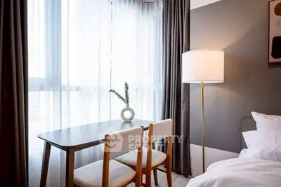 Modern bedroom with stylish decor and natural light