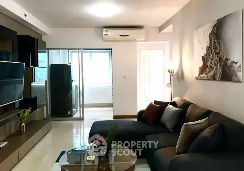 Modern living room with sleek furniture and stylish decor in a contemporary apartment.