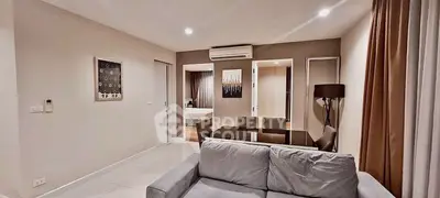 Modern living room with cozy sofa and dining area in stylish apartment
