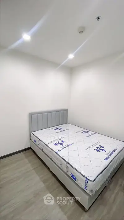 Modern bedroom with new mattress and minimalist design, perfect for a cozy living space.