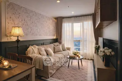 Cozy living room with elegant decor and stunning sunset view through large window.