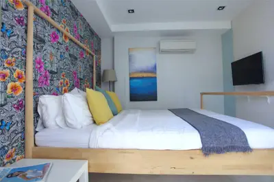 Stylish bedroom with floral accent wall and modern decor