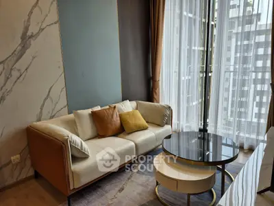 Modern living room with elegant sofa and city view balcony
