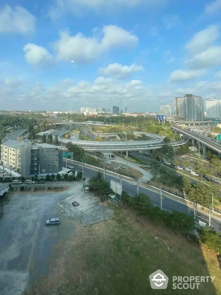 Stunning cityscape view from high-rise building showcasing urban infrastructure and skyline.