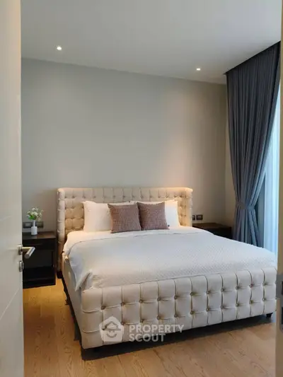 Luxurious bedroom with plush bed and elegant decor in modern apartment