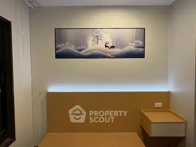 Modern bedroom with elegant wall art and minimalist design