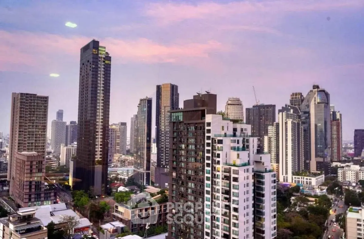Stunning city skyline view showcasing modern high-rise buildings at sunset.