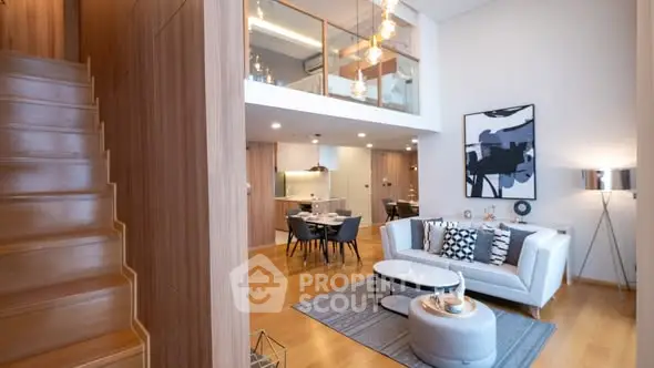 Modern duplex living room with stylish decor and open dining area