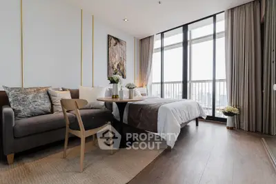 Luxurious modern bedroom with floor-to-ceiling windows and elegant decor.