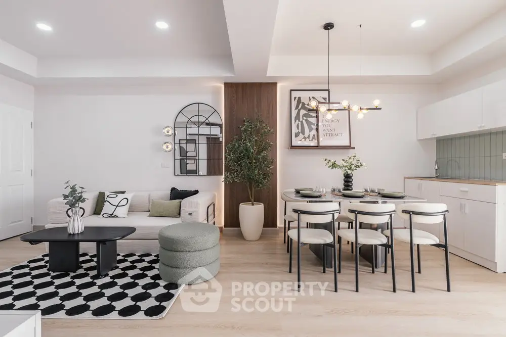 Modern open-plan living and dining area with stylish decor and natural light.