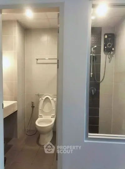 Modern bathroom with shower and toilet in sleek design