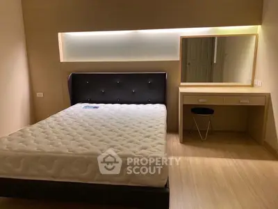 Modern bedroom with stylish bed and vanity in minimalist design
