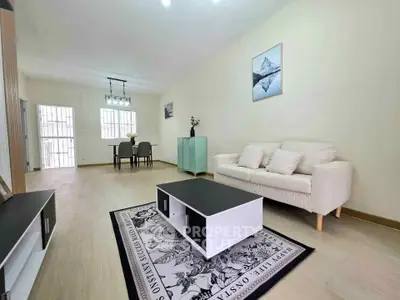 Spacious modern living room with elegant decor and dining area