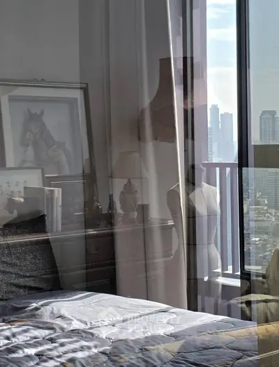 Luxurious bedroom with stunning city view and elegant decor