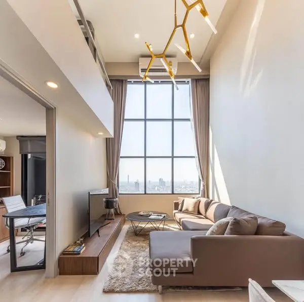 Luxurious high-ceiling living room with modern decor and city view.