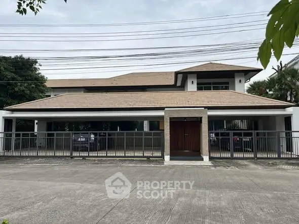 Spacious modern house with gated entrance and ample parking space.