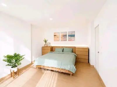Bright and spacious bedroom with modern decor and natural light