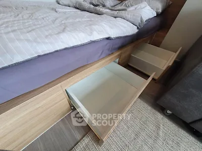 Modern bedroom with under-bed storage drawers and stylish bedding