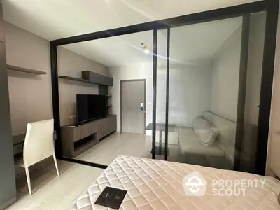 Modern bedroom with glass partition and stylish decor