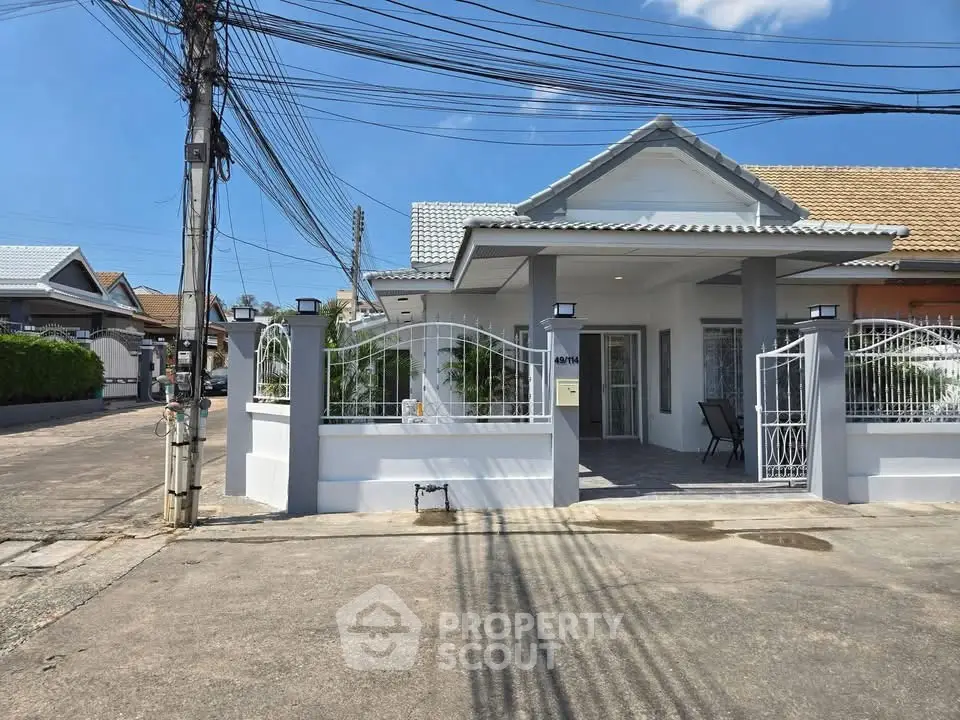 Charming single-story house with gated entrance and modern design in a quiet neighborhood.