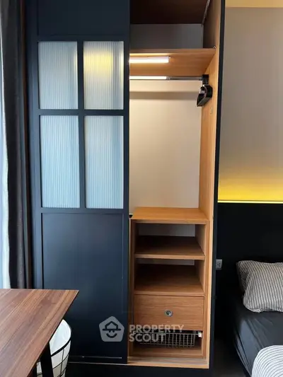 Modern bedroom with sleek built-in wardrobe and cozy lighting