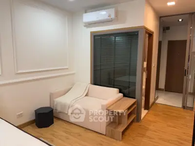 Modern living room with cozy sofa and air conditioning in stylish apartment