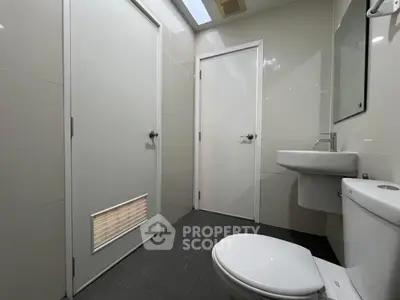 Modern minimalist bathroom with sleek fixtures and neutral tones