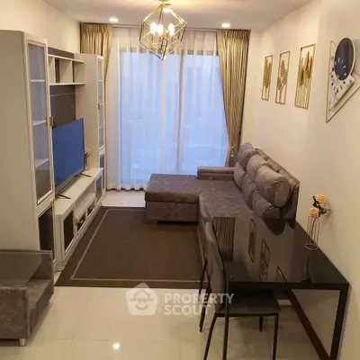 Modern living room with stylish decor, plush sofa, and elegant lighting in a cozy apartment setting.