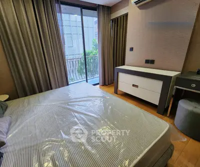 Modern bedroom with balcony access in a stylish apartment