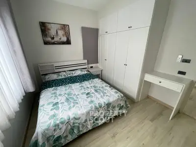 Cozy bedroom with stylish decor and ample storage space