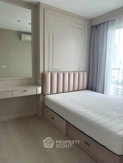 Modern bedroom with stylish decor and ample natural light, featuring a comfortable bed and elegant furnishings.