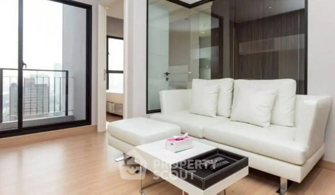 Modern living room with white sofa and city view balcony