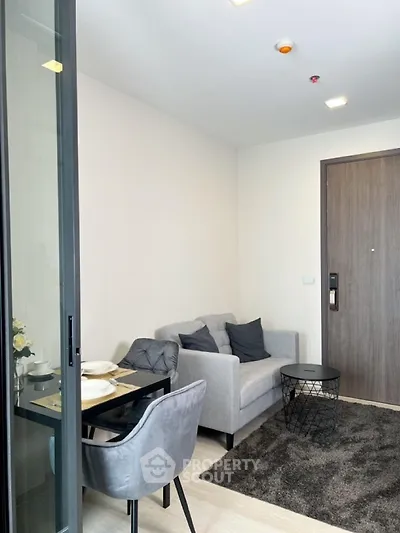 Modern living room with cozy sofa and dining area in stylish apartment