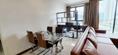 Modern living room with dining area and city view balcony in high-rise apartment.