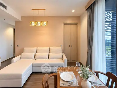Modern living room with elegant dining area and large window view