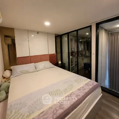 Cozy bedroom with walk-in closet and modern decor